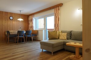 Panoramic Apartment, 1 Bedroom, Kitchen, Mountain View (Balcony) | Living area | 43-inch flat-screen TV with satellite channels, TV, toys - Zenauerhof (Sankt Martin bei Lofer)