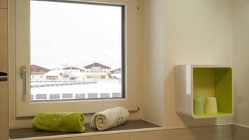 Panoramic Apartment, 1 Bedroom, Kitchen, Mountain View (Balcony) | Bathroom | Shower, hair dryer, heated floors, towels