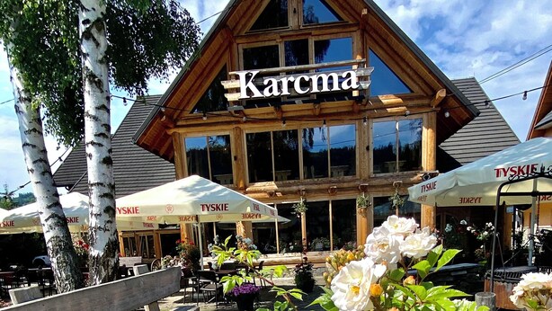 A wooden building with a sign reading "Karcma". - Zajazd Białczański (Bukowina Tatrzanska)
