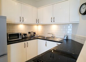 Luxury Apartment, Ensuite, Sea View (2 Bedroom ) | Private kitchen | Full-sized fridge, microwave, stovetop, dishwasher