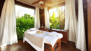 A bedroom with a bed, a wooden nightstand, a ceiling fan, and a window with curtains. - The LifeCo Bodrum Well - Being Center - Adults Only (Bodrum)