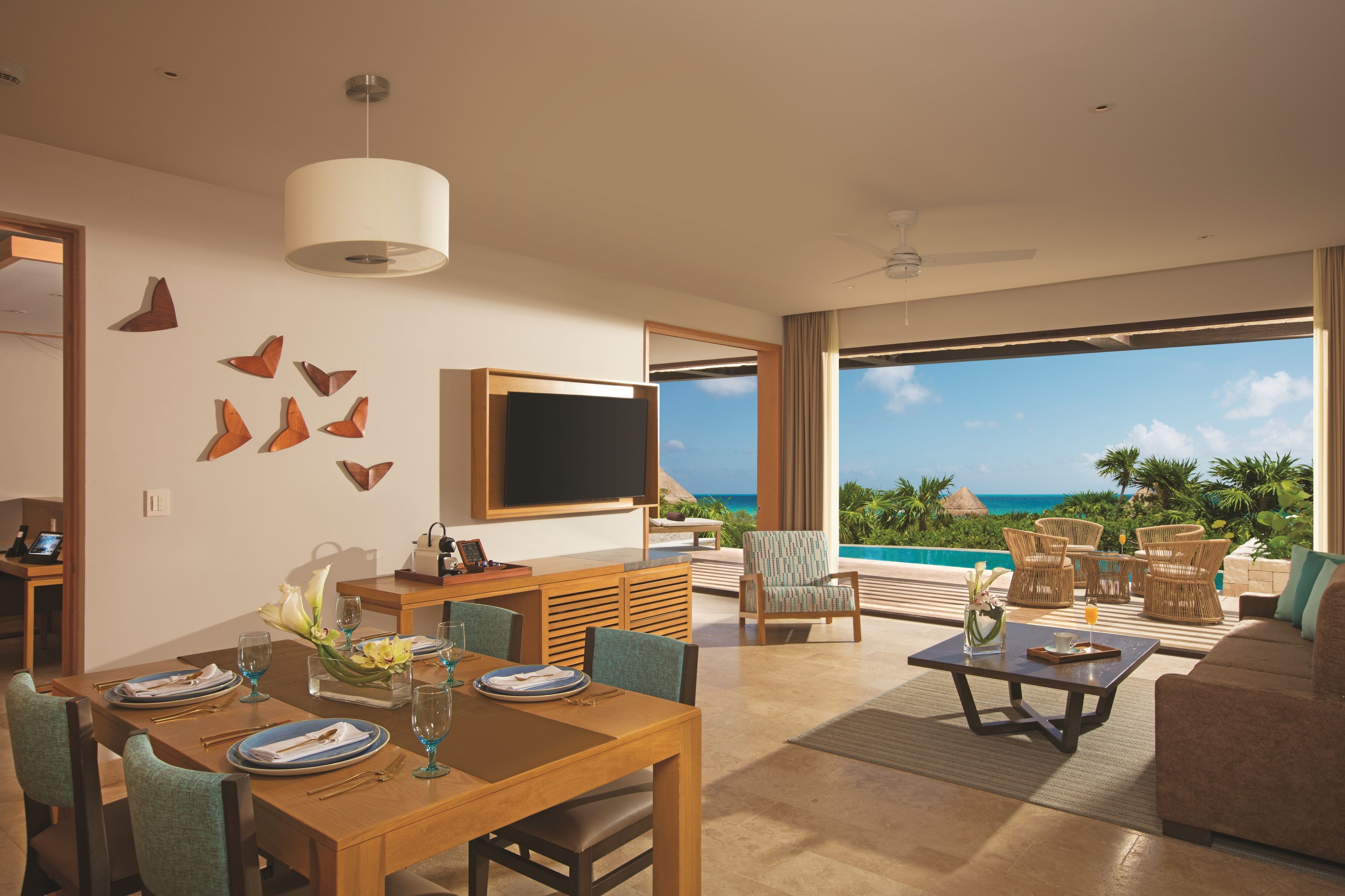 Preferred Club Master Suite Ocean Front with Private Pool - King Bed | Living area | 48-inch flat-screen TV with satellite channels, TV, books