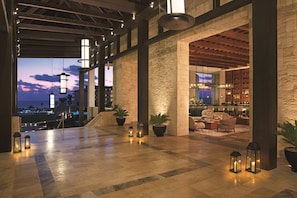 Relax in our spacious lobby with high ceilings, exposed beams, and comfortable seating areas.
