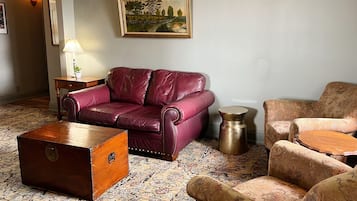 Premium Suite | Living area | 55-inch flat-screen TV with cable channels, TV