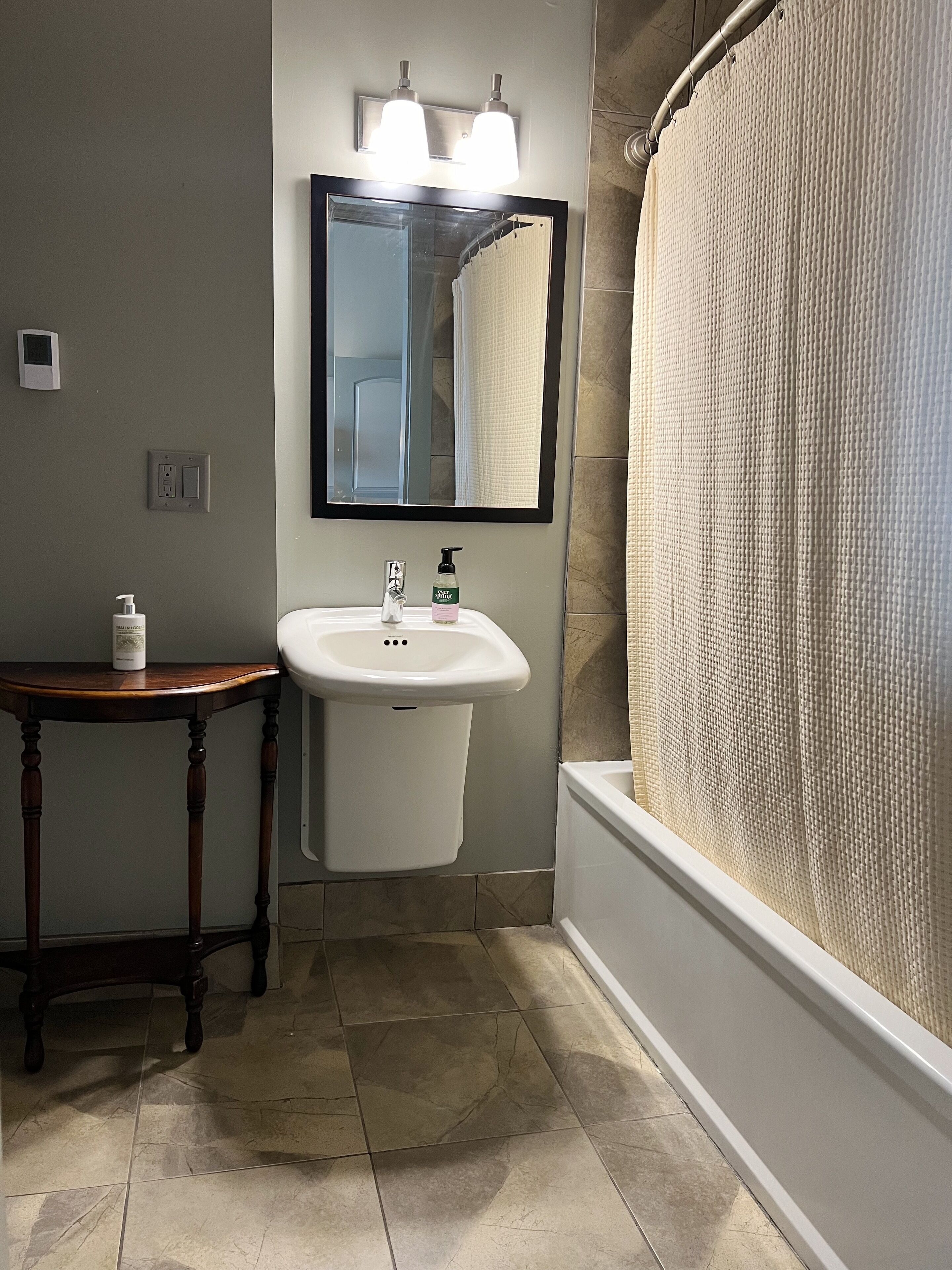 premium suite | bathroom | designer toiletries, hair dryer, towels