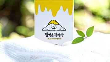 A box of Jeju Honey Stick with a mountain illustration and Korean text.