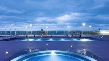 Seasonal outdoor pool, open 3:00 PM to 9:00 PM, pool loungers