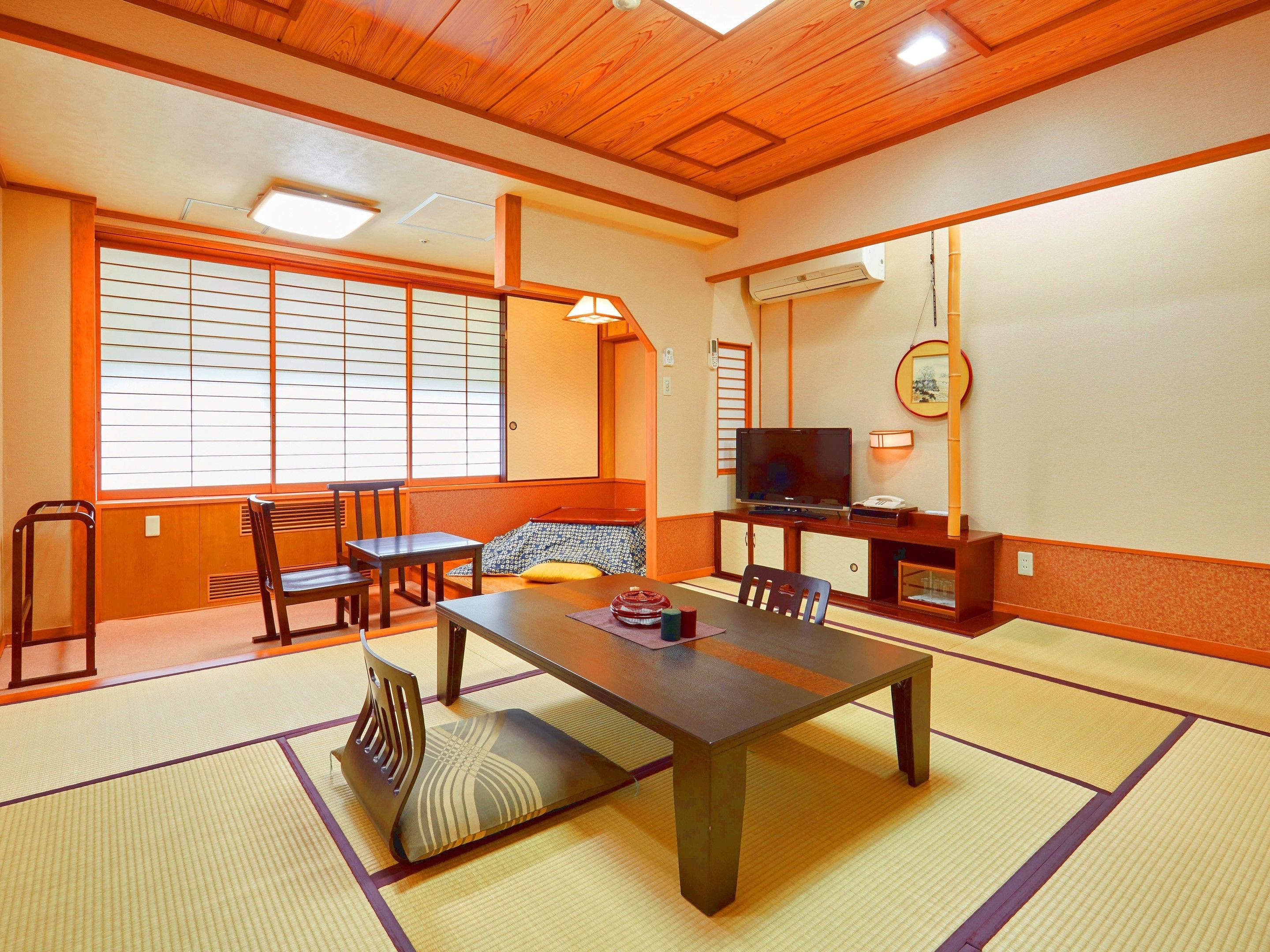 japanese style family room, river view | living area | tv