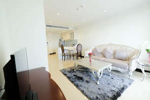 Suite, 1 King Bed, City View | Living area | 40-inch LCD TV with cable channels, TV, DVD player - LK President (Pattaya)