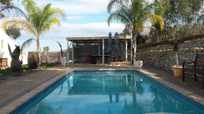 Outdoor pool, pool umbrellas, pool loungers