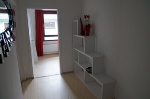 Deluxe Suite, 2 Bedrooms, Balcony | Living area | Flat-screen TV, DVD player
