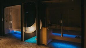 A modern hotel entrance with a glass door, a reception desk, and a visible bathroom area. - Relais Colle Buono (Alvito)