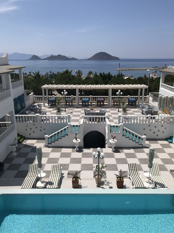 Outdoor pool, open 10:00 AM to 8:00 PM, pool umbrellas, sun loungers