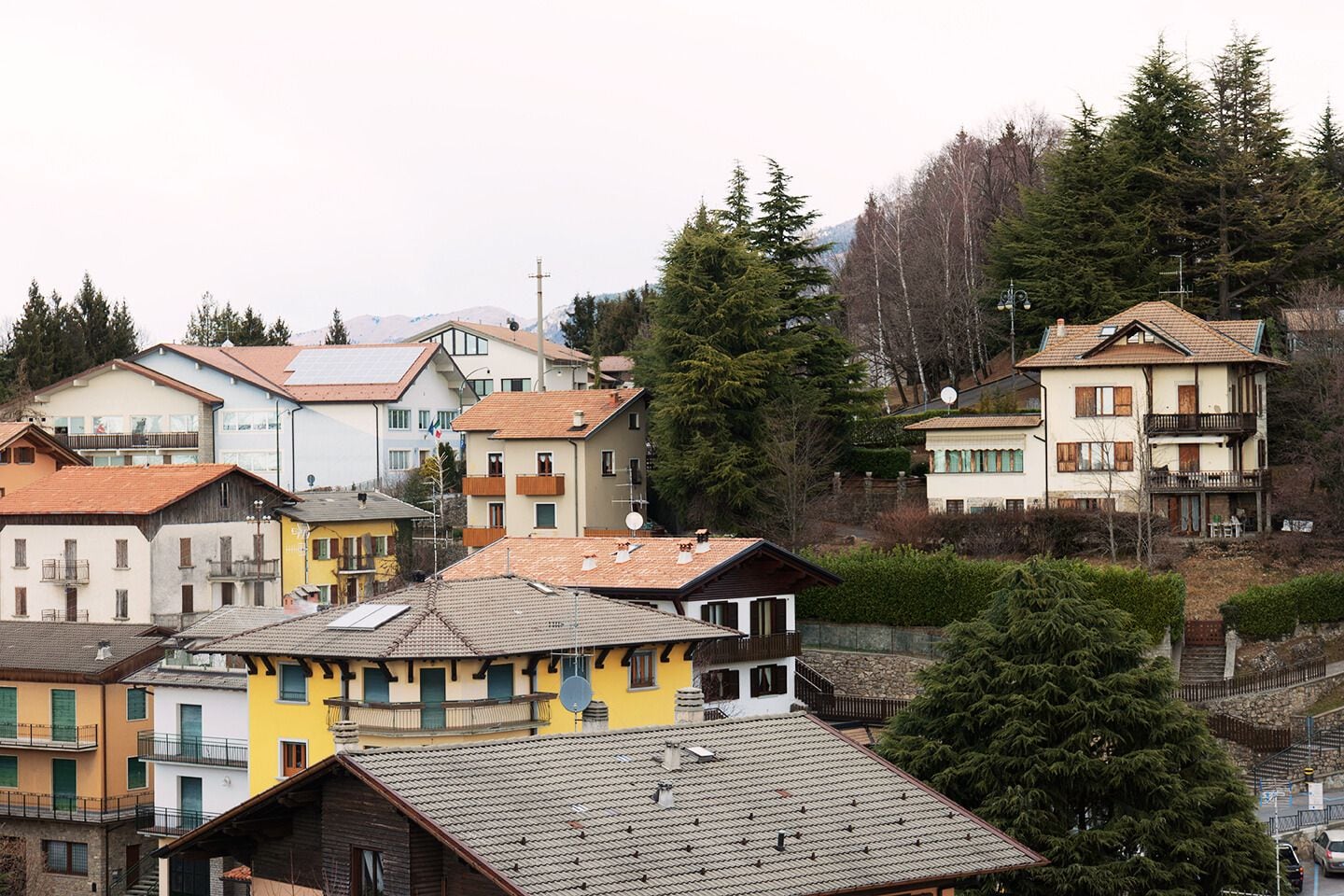 A residential area with multi-story buildings, some with balconies, and a mix of architectural styles.