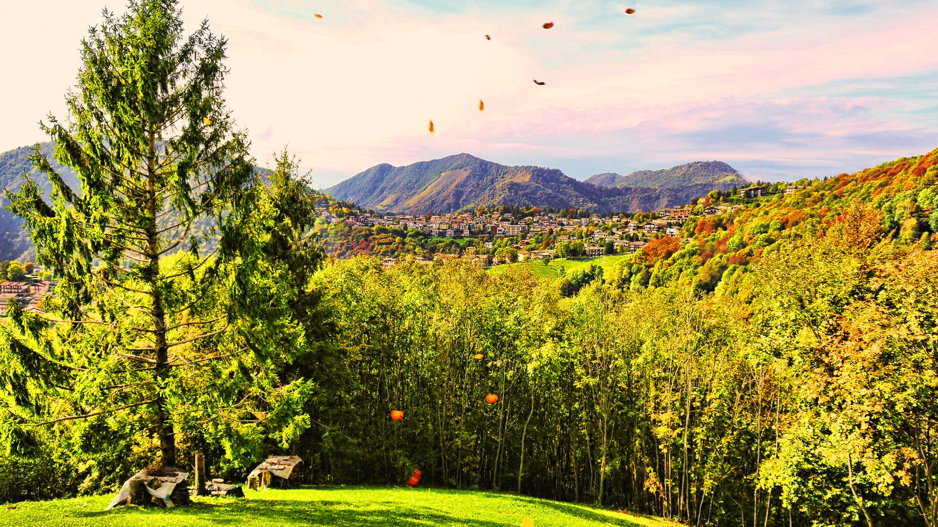 A mountainous landscape with a village nestled in the valley.