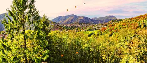 A mountainous landscape with a village nestled in the valley.