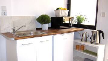 Rooftop Studio with Terrace | Private kitchenette | Full-size fridge, microwave, electric kettle, cookware/dishes/utensils