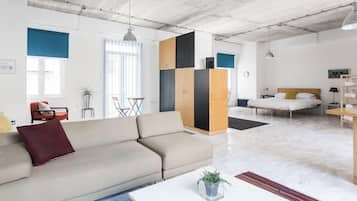 Deluxe Studio with Balcony | Living area | Flat-screen TV