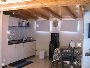 Full-size fridge, microwave, espresso maker, cookware/dishes/utensils