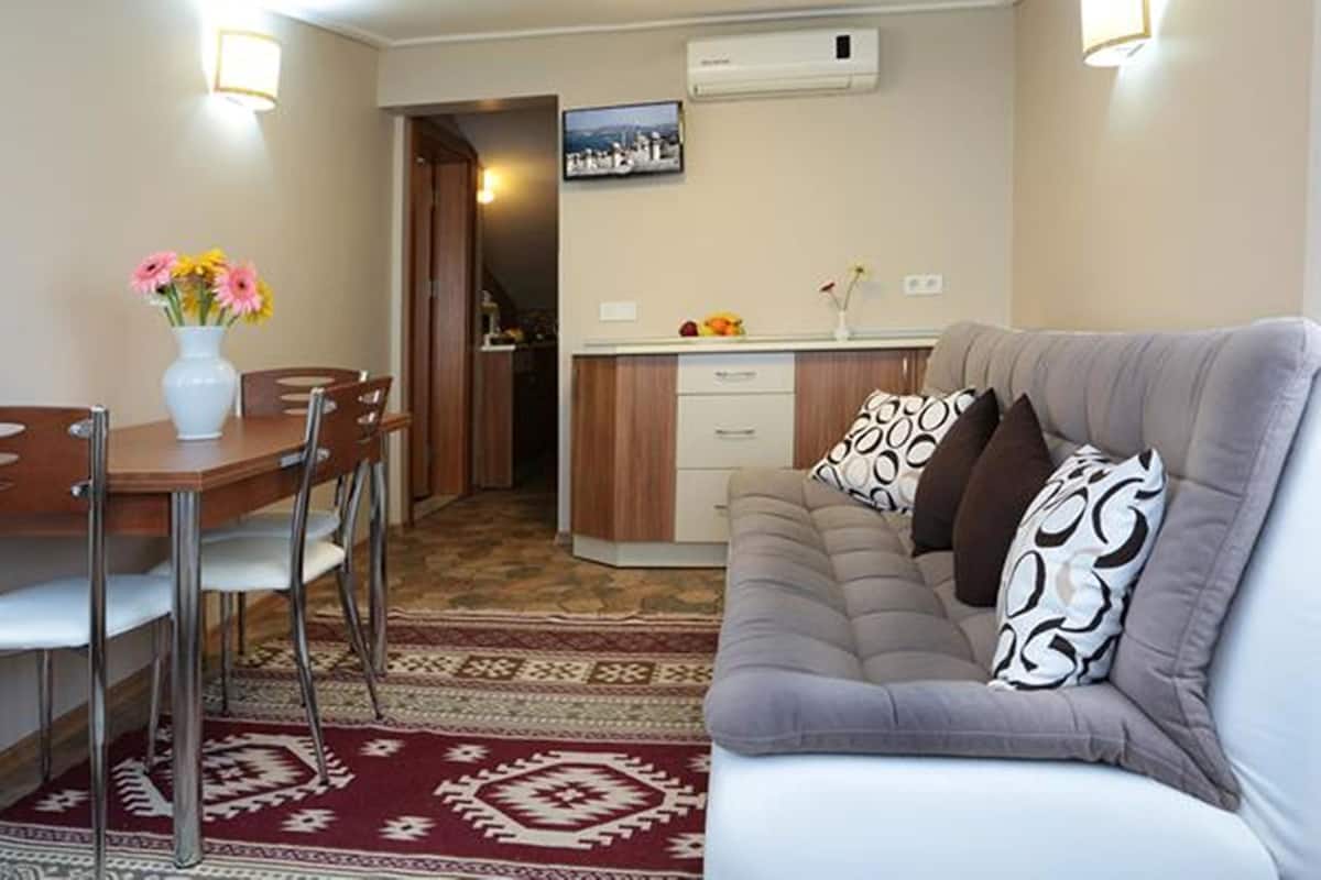 Apartment, 1 Bedroom, Sea View | Premium bedding, in-room safe, desk, iron/ironing board