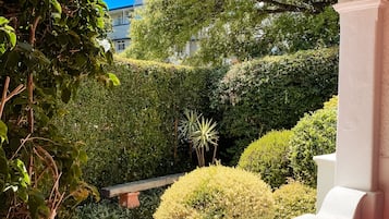 Family Apartment, 1 Bedroom, Patio, Garden Area | Premium bedding, in-room safe, individually furnished, laptop workspace