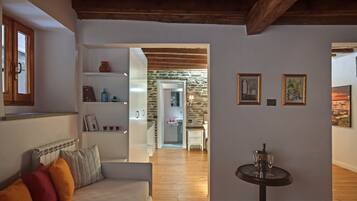 Quadruple Room | Living area | Flat-screen TV