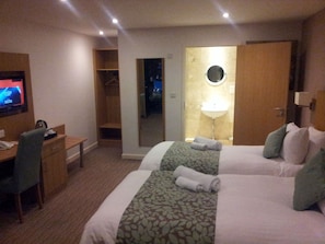 Desk, laptop workspace, iron/ironing board, travel cot