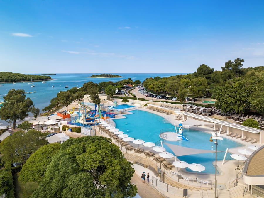 2 outdoor pools, open 9 AM to 7 PM, pool umbrellas, pool loungers