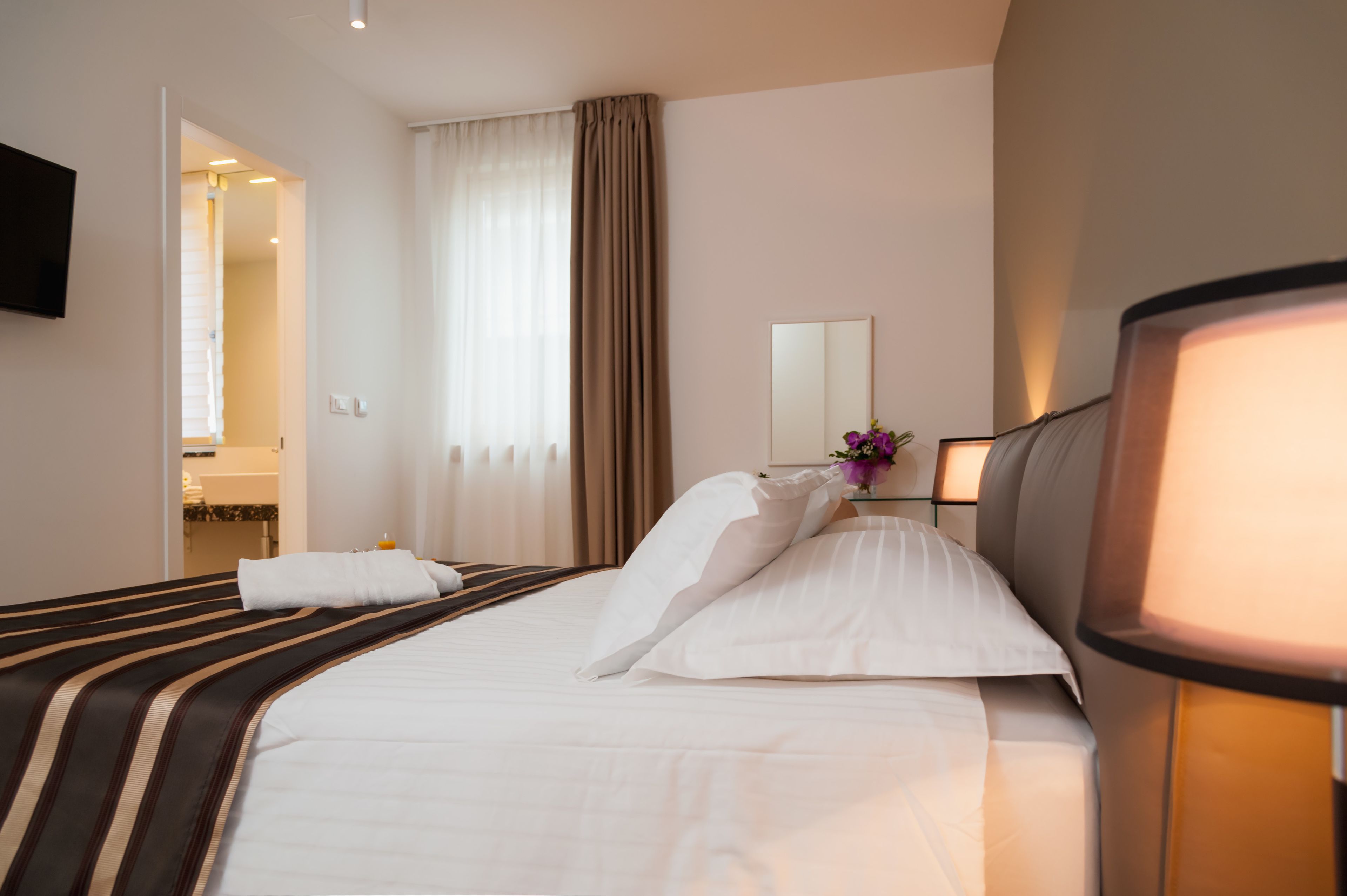 luxury two bedroom suite | premium bedding, in-room safe, desk, soundproofing