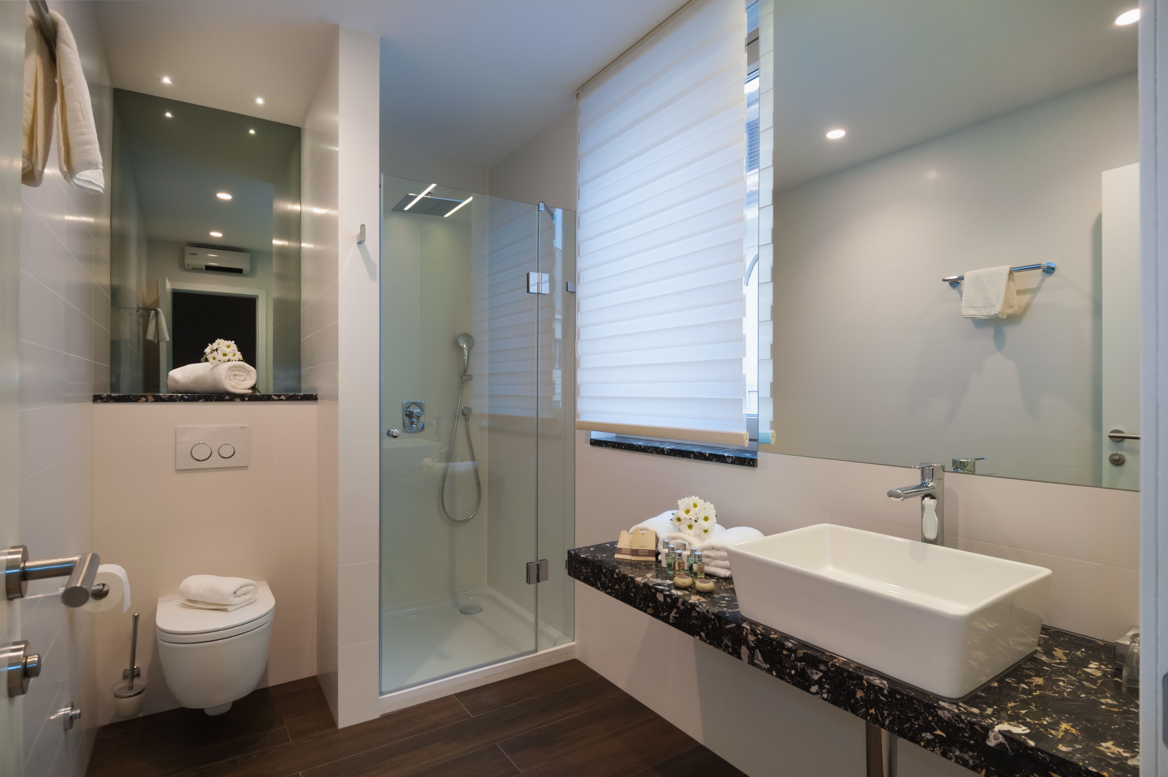 luxury two bedroom suite | bathroom | free toiletries, hair dryer, slippers, towels