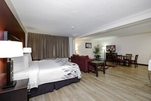 Suite, 1 kingsize bed, niet-roken, bubbelbad | Een bureau, verduisterende gordijnen, een strijkplank/strijkijzer