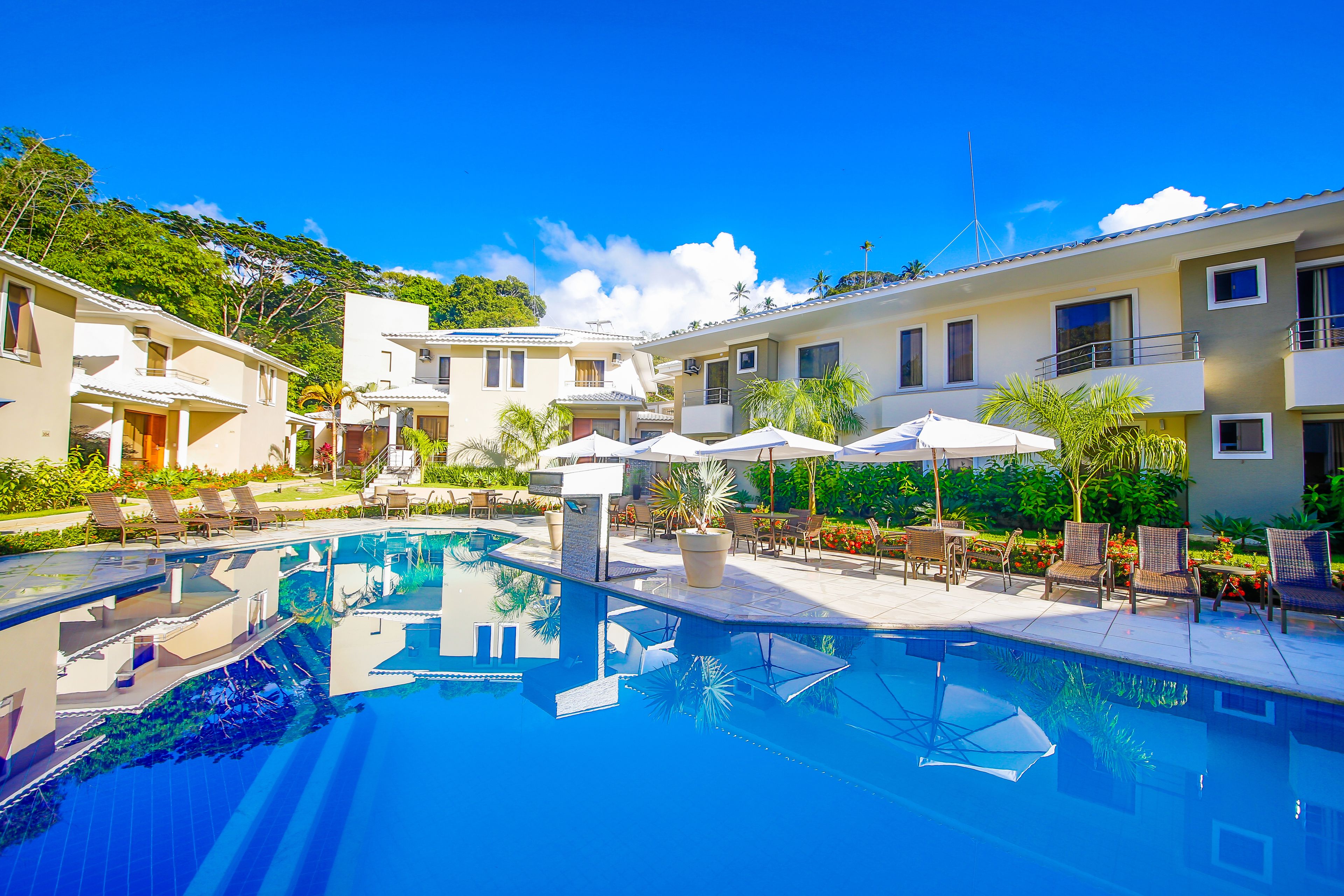 Outdoor pool, open 10 AM to 10 PM, pool umbrellas, pool loungers