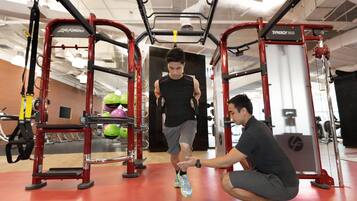 A gym with exercise equipment, including a pull-up bar and weight machines.