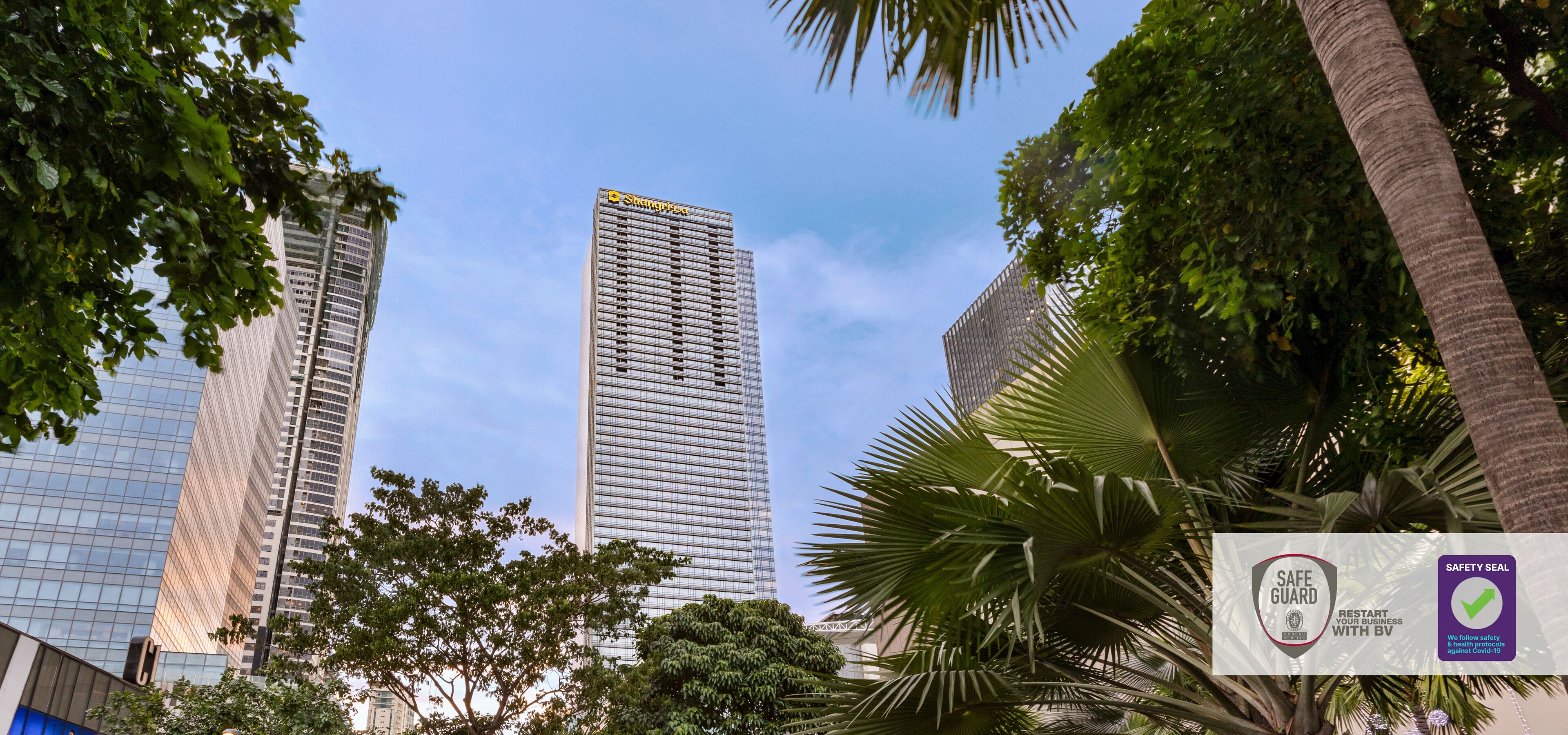 A modern high-rise building with a clear sky.