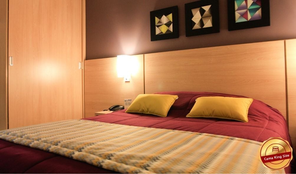 deluxe room | minibar, in-room safe, individually decorated, desk