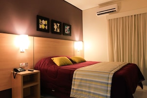 Deluxe Room | Minibar, in-room safe, individually decorated, desk