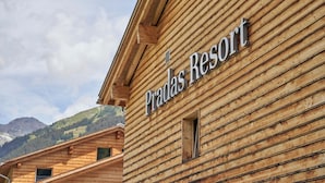 A wooden building with the sign "Pradas Resort" indicating a hotel or resort. - Pradas Resort Brigels (Brigels)
