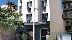 A tall, modern building with multiple balconies and air conditioning units. - Real Grandeza (Rio de Janeiro)