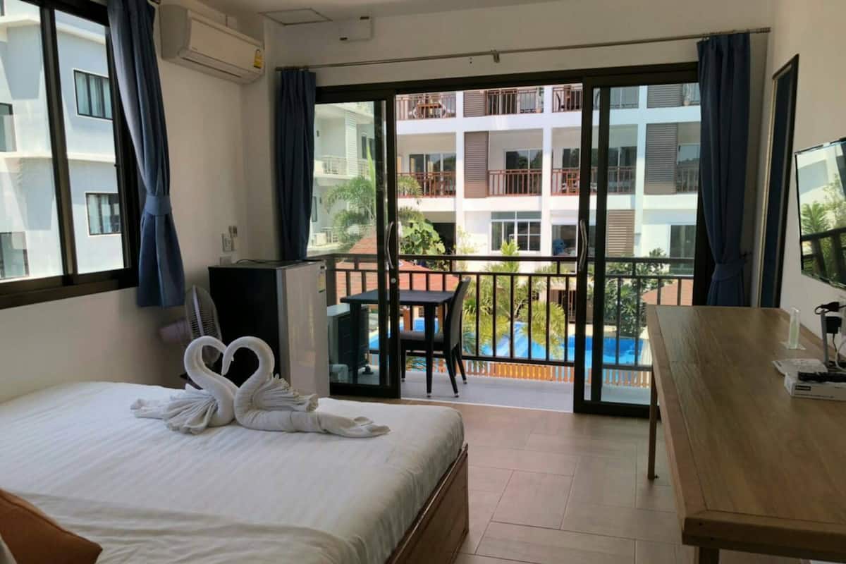 Economy Double Room | 1 bedroom, down comforters, blackout drapes, free WiFi