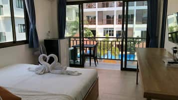 Economy Double Room | 1 bedroom, down comforters, blackout drapes, free WiFi