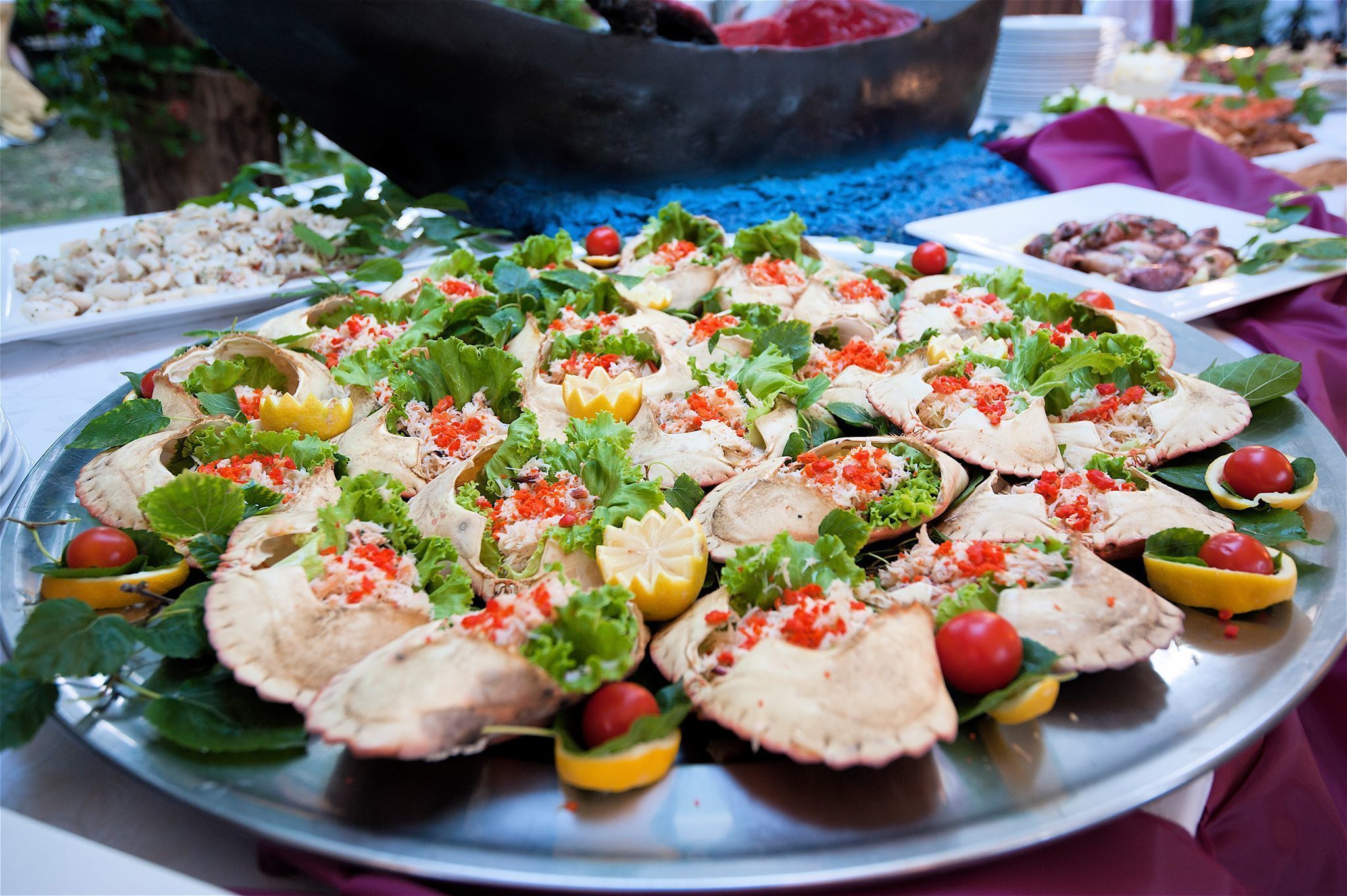 A large platter of seafood appetizers arranged on a table.