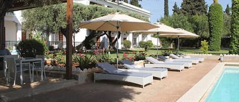 2 outdoor pools, pool umbrellas, pool loungers