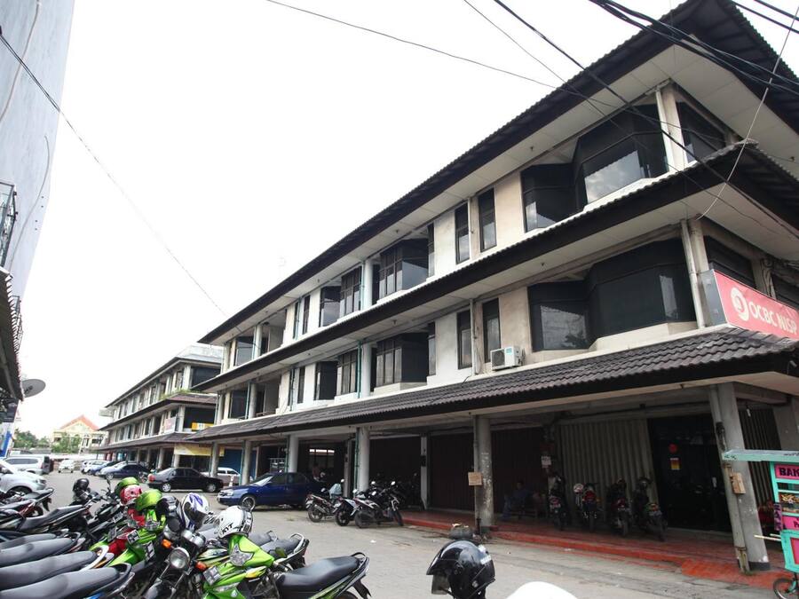 A multi-story building with a commercial ground floor.