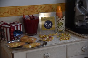 Enjoy a delicious breakfast spread with pastries, juice, and a refreshing beverage.