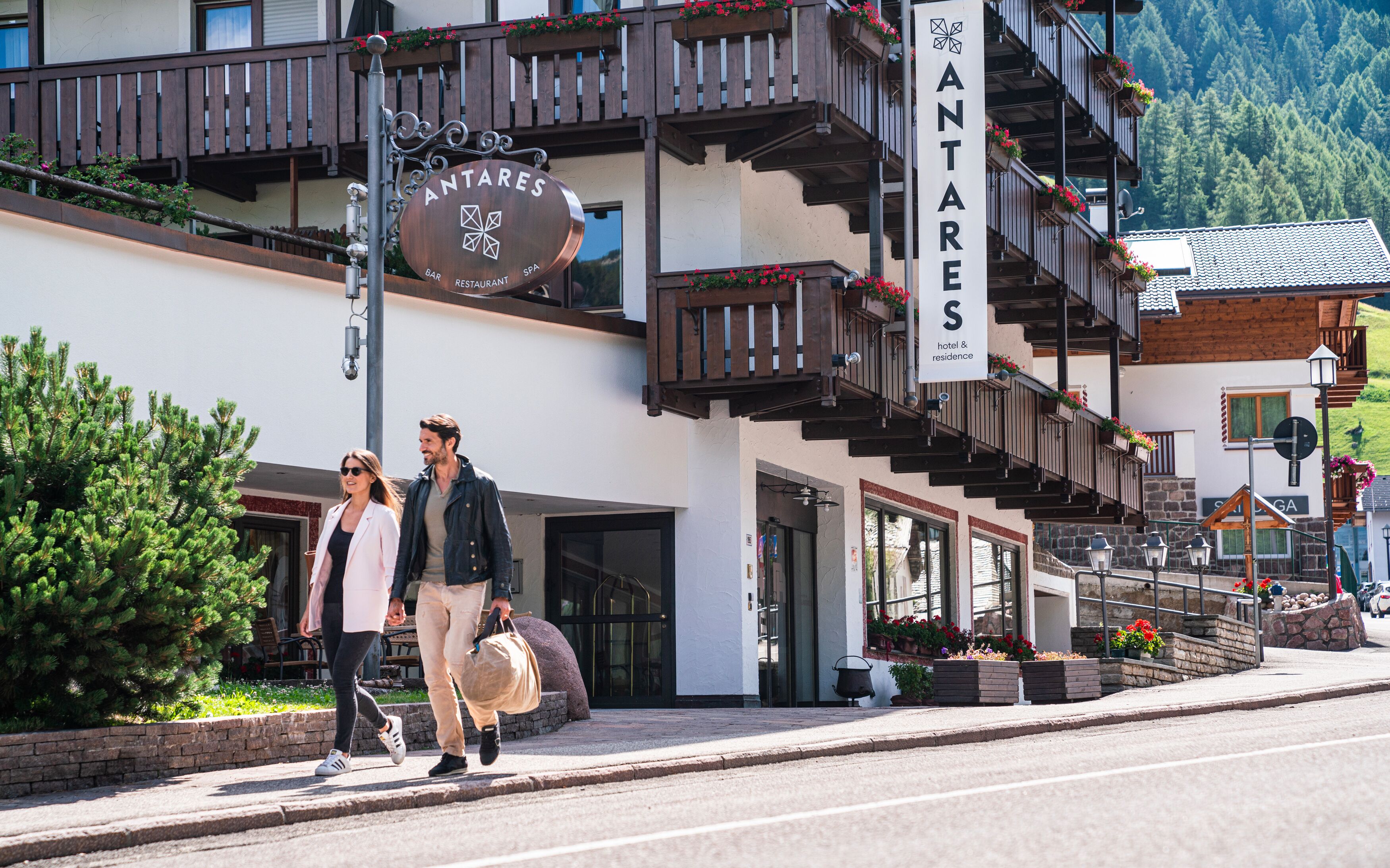 A building with a sign reading "ANTARES" and "BAR RESTAURANT SPA".