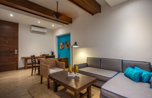 Suite, 1 King Bed, Terrace | Living room | 40-inch LED TV with satellite channels, TV