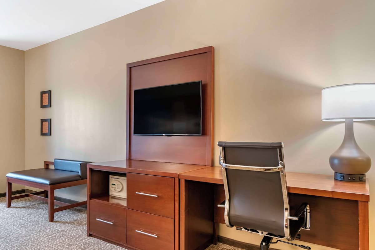 Premium bedding, desk, laptop workspace, iron/ironing board
