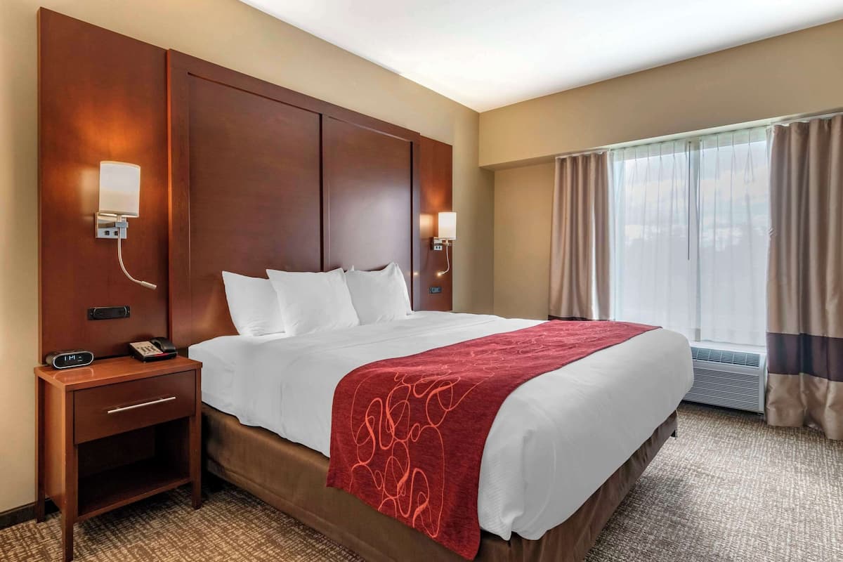 Premium bedding, desk, laptop workspace, iron/ironing board