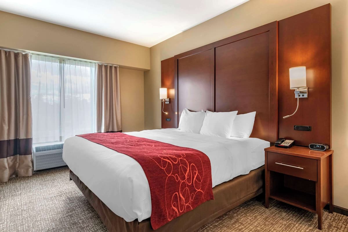 Premium bedding, desk, laptop workspace, iron/ironing board