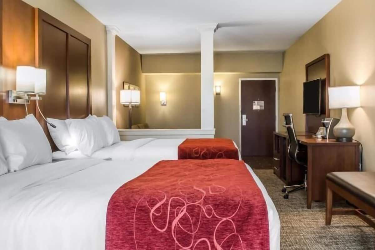 Premium bedding, desk, laptop workspace, iron/ironing board